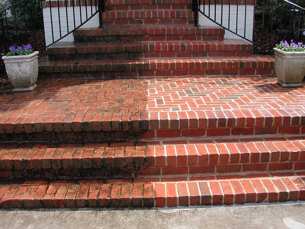 comparison photo of power washed brick by Envision Property Maintenance